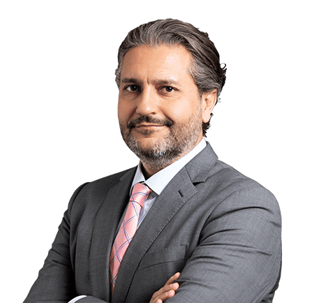 Image of Arash Nematollahi wearing business suit smiling at the camera