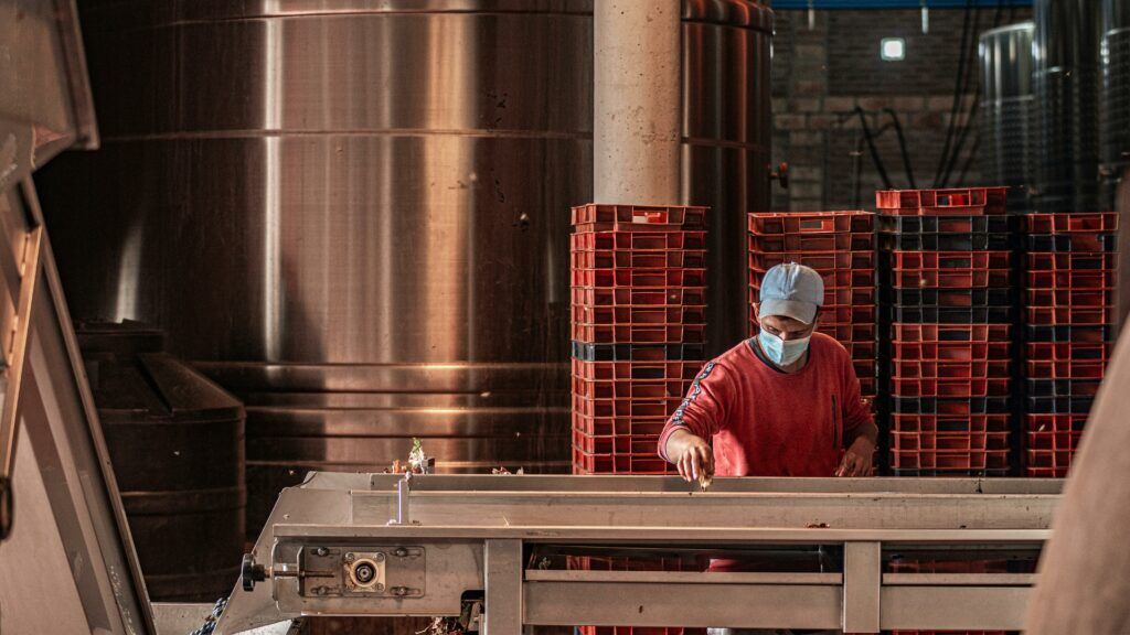 A male factory worker on a production line.